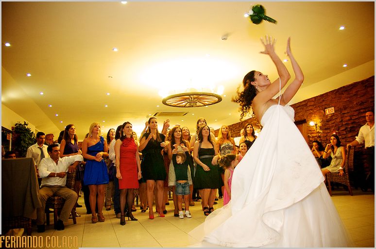 The bride throws her bouquet to the singles.