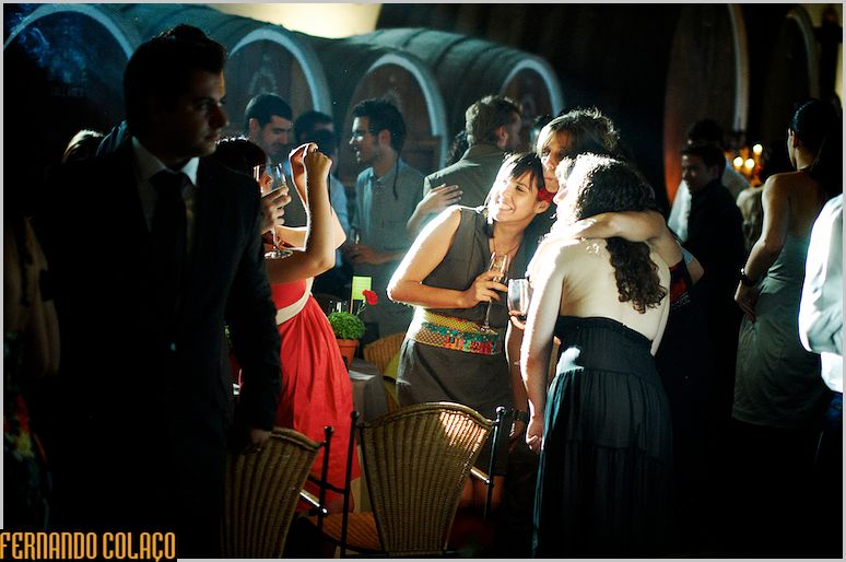 Guests at the wedding party take photographs.