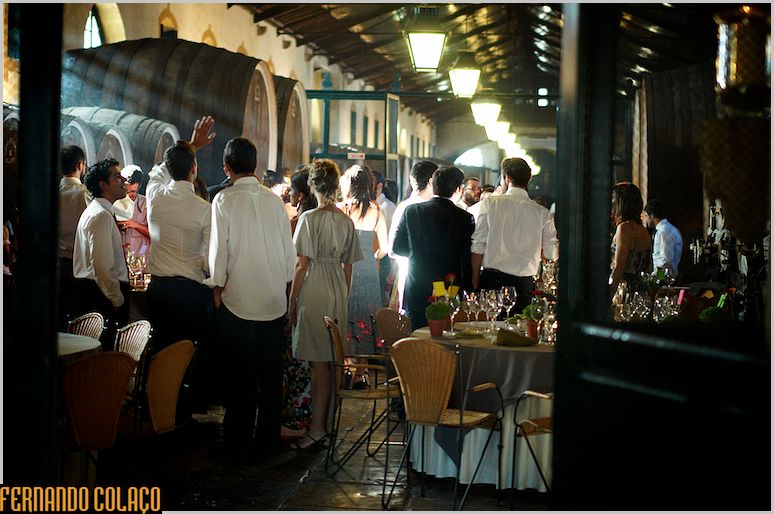 Wedding guests socializing at the back of the Adega Regional de Colares.