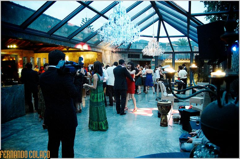 View of the wedding party room at Adega Regional de Colares with guests dancing.
