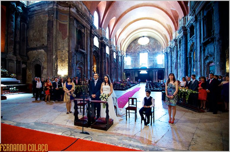 General view of the Church of S. Domingos in Lisbon with bride and groom and wedding guests.