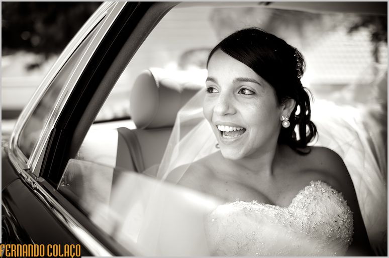 Inside the car the bride talking to someone.