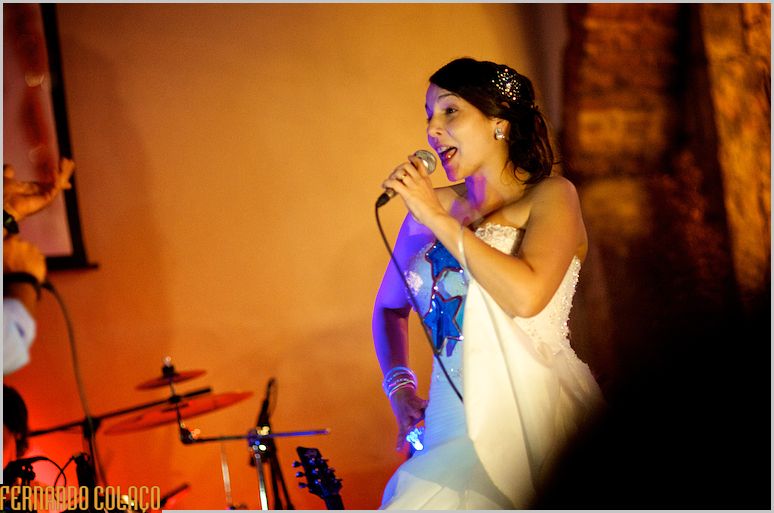 The bride singing at her wedding reception.