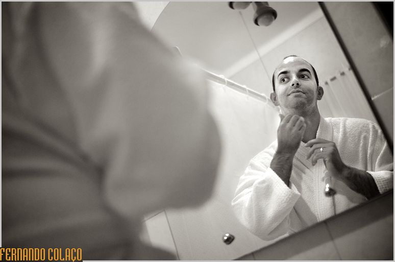 The groom prepares to shave.