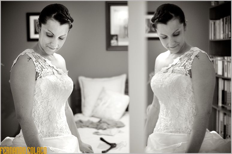 Bride, with reflection in mirror, looks down.