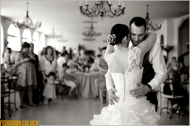 Dancing in the middle of the wedding reception room at Quinta do Palhas, the bride and groom open the ball.