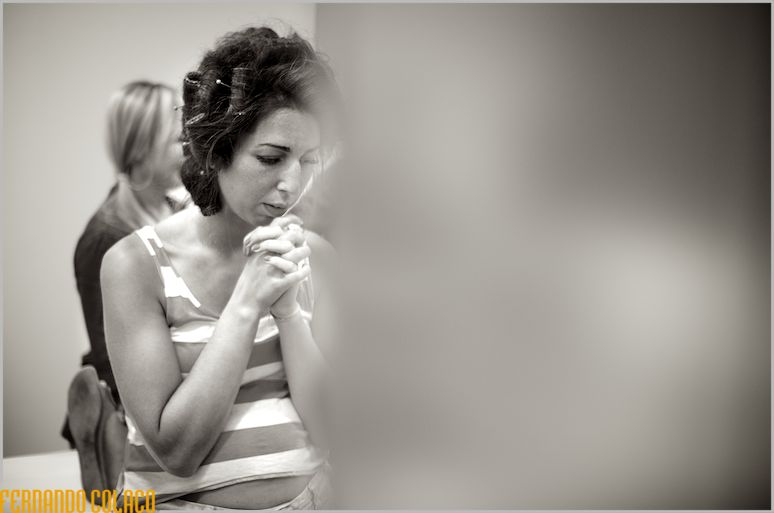 The new one with joined hands, before starting her preparation for the wedding.