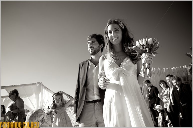 The bride, with her brother arrives at the wedding ceremony site at the Waikiki bar.