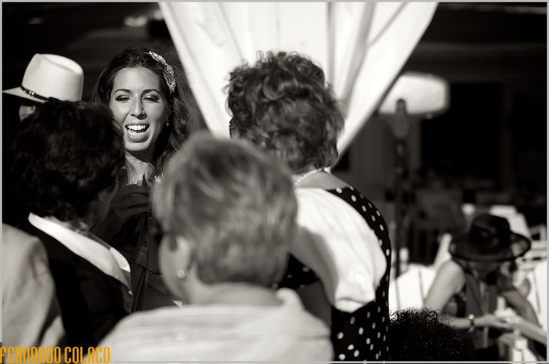The bride chats with guests who congratulate her on her wedding.