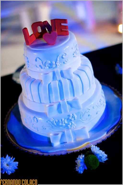 The bride and groom's cake under a blue light.