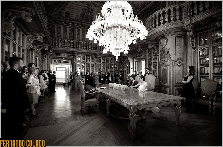 The library room of the Palácio da Rocha do Conde d'Óbidos with the bride and groom and guests for the wedding ceremony.