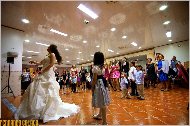 The bride's bouquet in the air, tossed by her and to be picked up by the singles at the wedding.