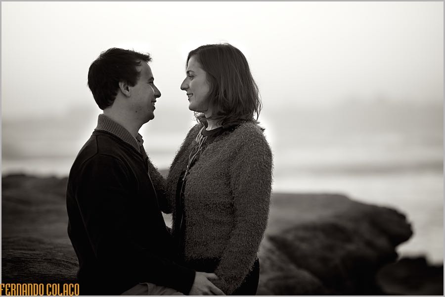 After sunset, the couple, face to face, looking into each other's eyes, in the elopement session with the wedding photographer.