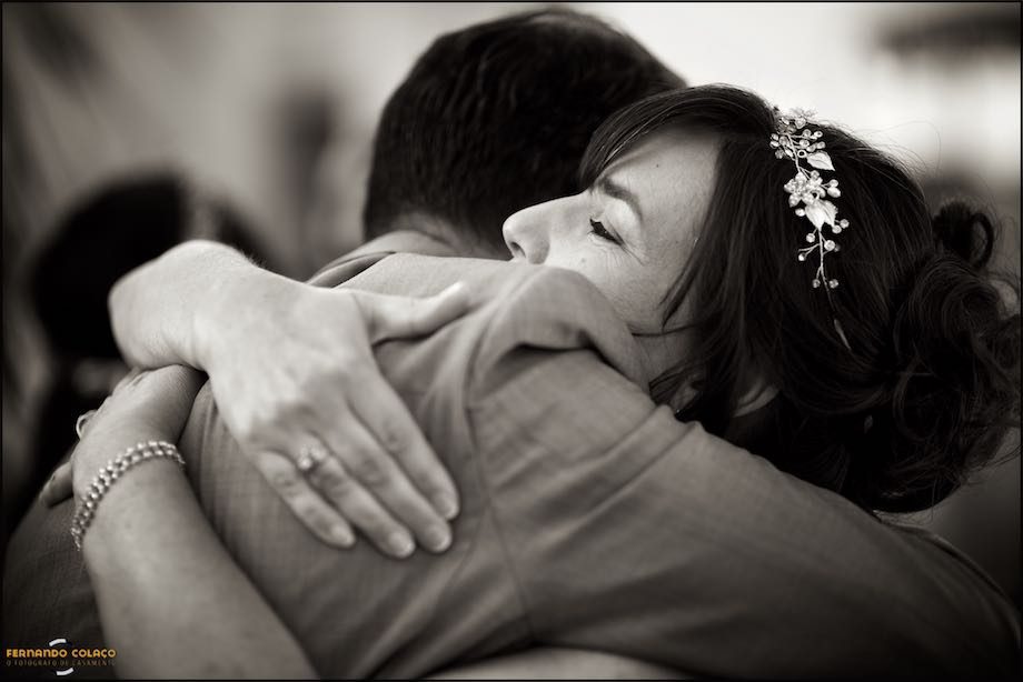 The bride hugs a wedding guest when the wedding ceremony is over, at the time of greetings.