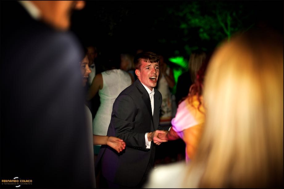 A wedding guest dances among others during a party at Morada do Sol in Sintra.