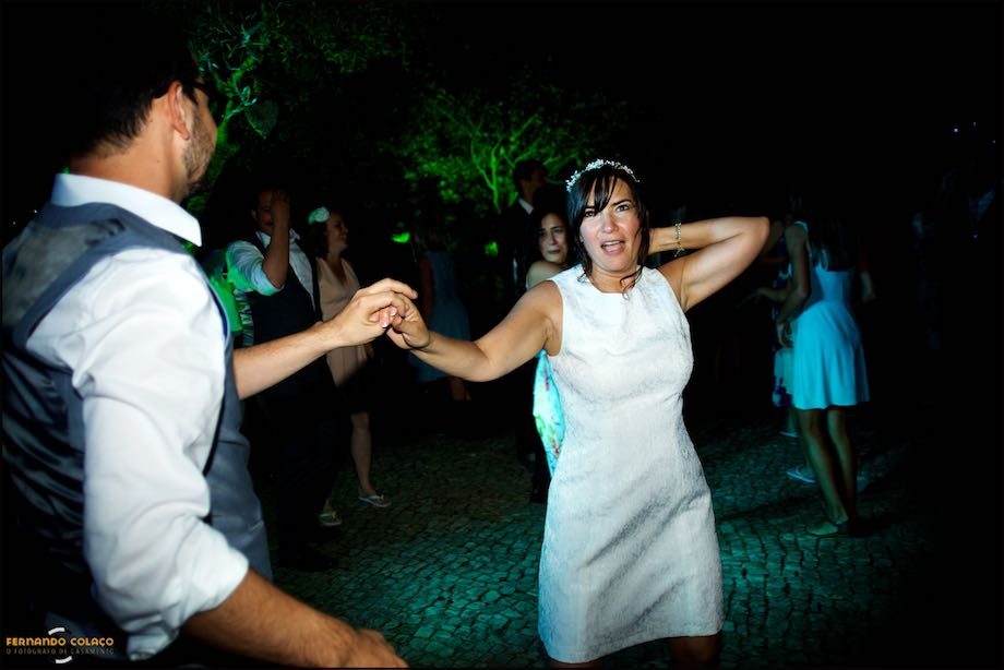 The bride dances with a wedding guest.