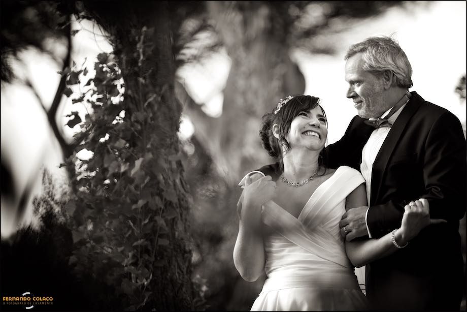 With two blurred trees in the background, the new ones play looking at each other laughing hard.