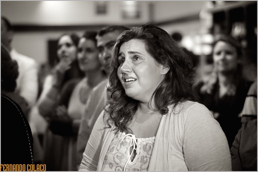 A wedding guest, emotional, when she sees a film about the bride and groom during the party at Club Nau in Ferragudo.