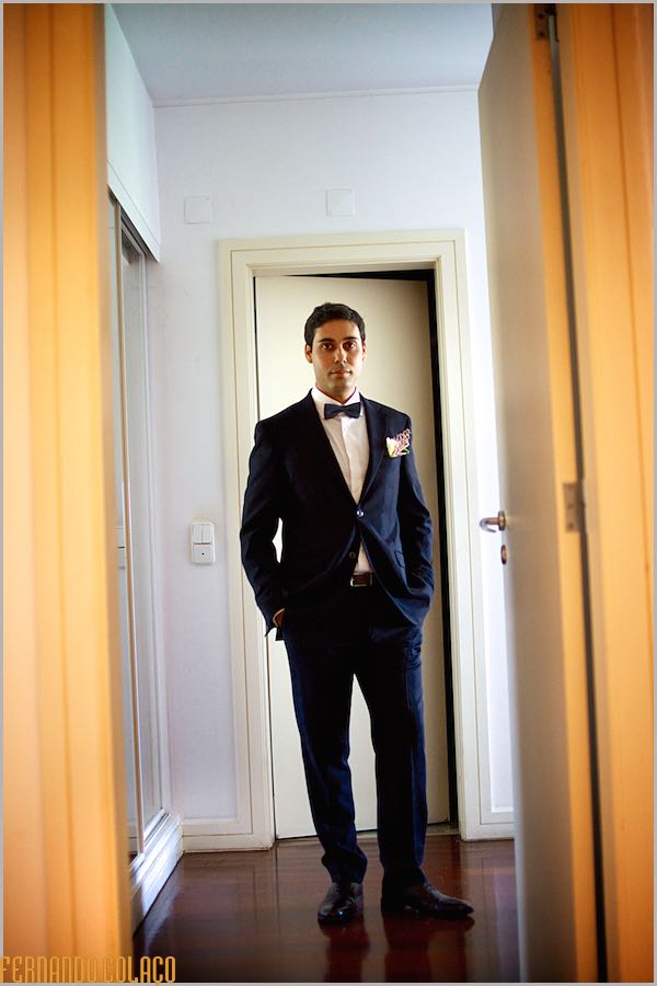 Standing, the groom, with his hands in his pockets and ready to go to the wedding ceremony.