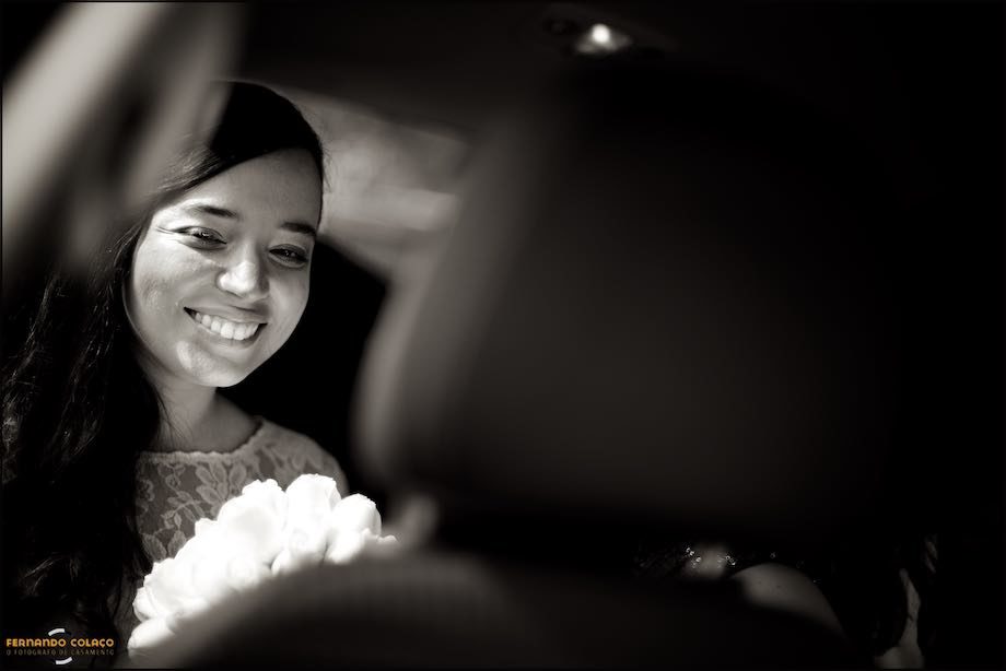 Bride arriving at the wedding ceremony, inside the car.