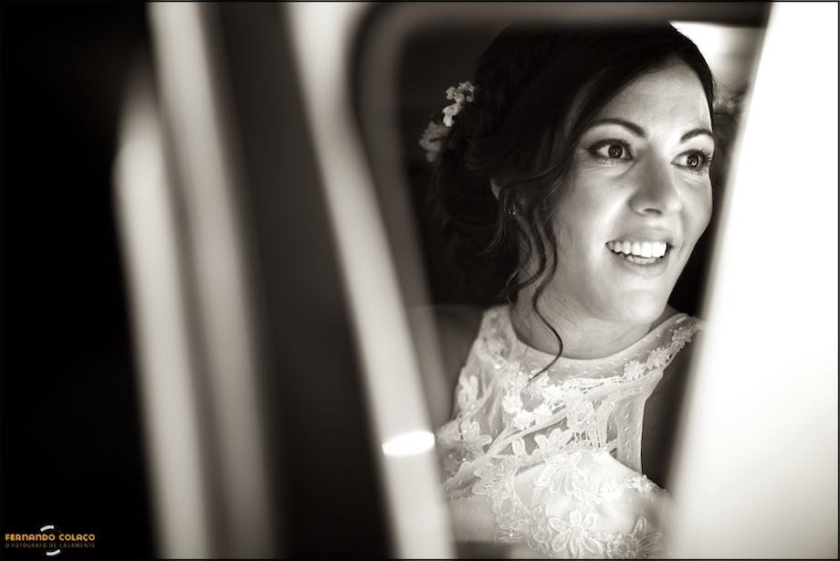Bride in the car that brought her to her wedding ceremony.