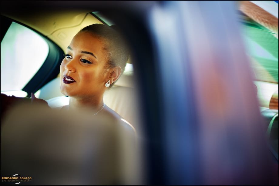 Bride in the car as she leaves for her wedding ceremony.