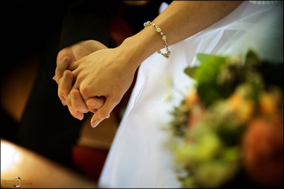 The bride and groom hold hands after the wedding ceremony.