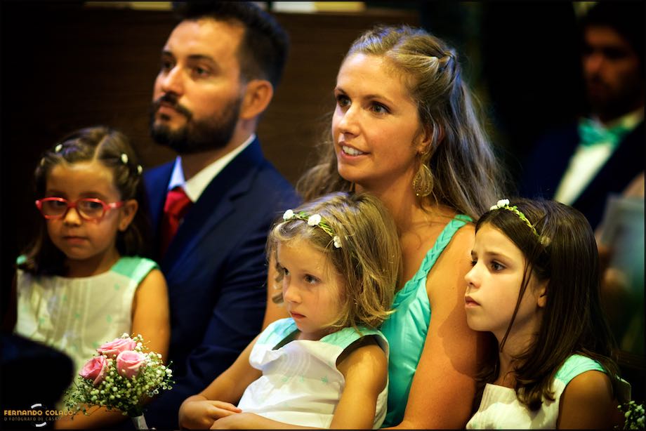 Parents with their three daughters during the wedding ceremony.