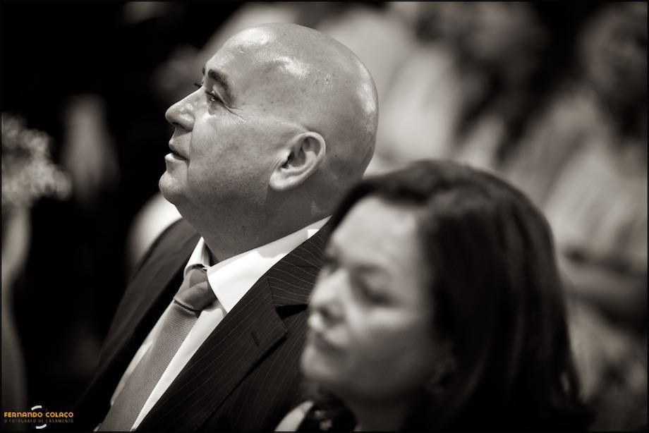 The bride's father, attentive to what is happening at his daughter's wedding ceremony.