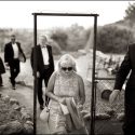 Wedding guests on the move to the ceremony location, followed by the wedding photographer in Portugal.