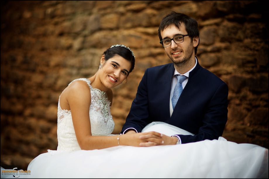 Bride and groom looking in front in the wedding photo session.