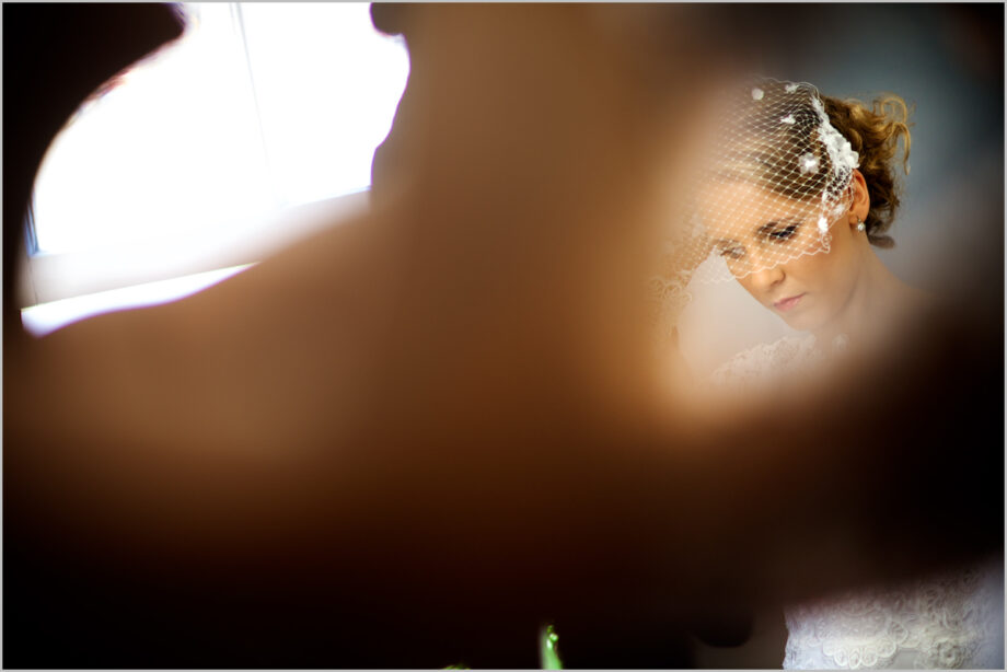 Bride with veil mask ready to go to the wedding ceremony.