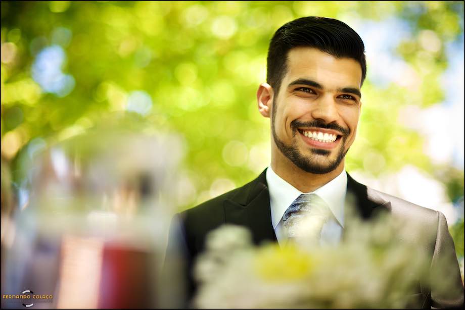 The groom with a big smile of happiness at the wedding ceremony.