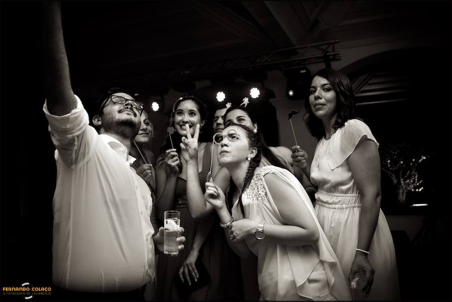 Guests at the wedding party taking a selfie.