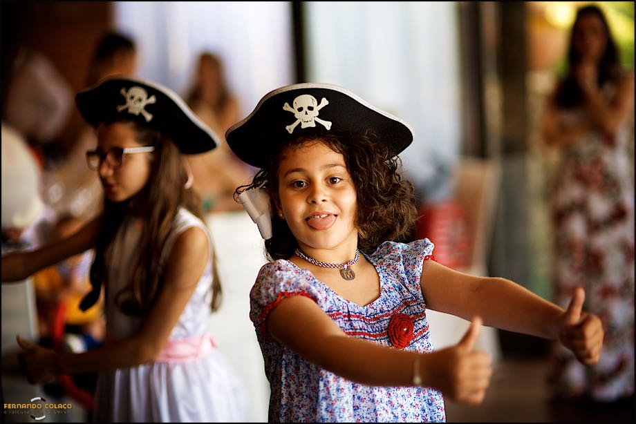 Little girl dressed as a pirate in a wedding party play.