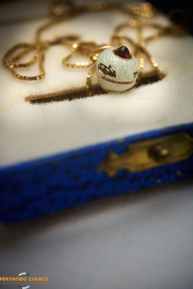 Detail of the bride's necklace, a porcelain walnut with a ruby.