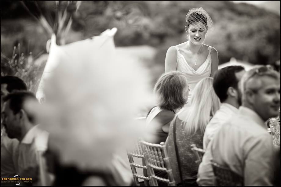 The bride amongst her guests talking to them.