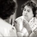 The mother of the bride, spotted by the wedding photographer in Sintra, touching up her make-up in a mirror, moments before leaving for her daughter's wedding ceremony.