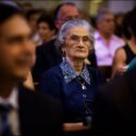 The groom's grandmother listens attentively to what is going on at the wedding ceremony in the Igreja Matriz in Reguengos de Monsaraz, as seen by the wedding photographer in Évora.