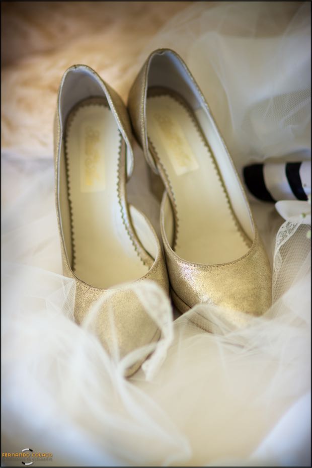 The bride's shoes on the satin of the veil, just before they are put on and the bride leaves for the wedding ceremony.