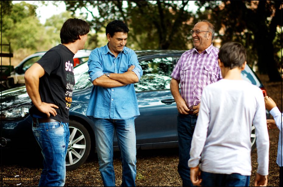 Some of the groom's friends and family chat amongst themselves as he prepares for his wedding day at Quinta D. Nuno in Fátima.
