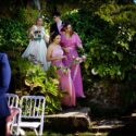 Surrounded by her son and two daughters, in the old garden of Quinta do Pé da Serra, the bride begins her walk to the wedding ceremony table.